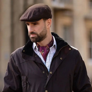Clare Haggas Cravats shown on Gentlemen wearing a shooting cravat silk accessory with a pheasant and mulberry design