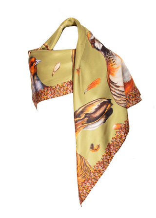 Green scarf with bird and feather pattern on a white background