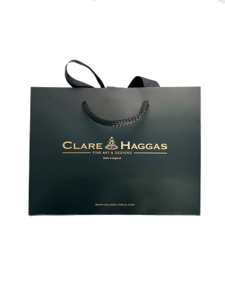 Clare Haggas gift wrap and packaging with signature black luxury rope handle bag